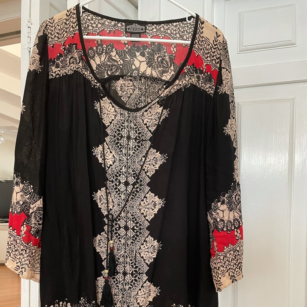 Angie boho knee length shift dress with tassels.